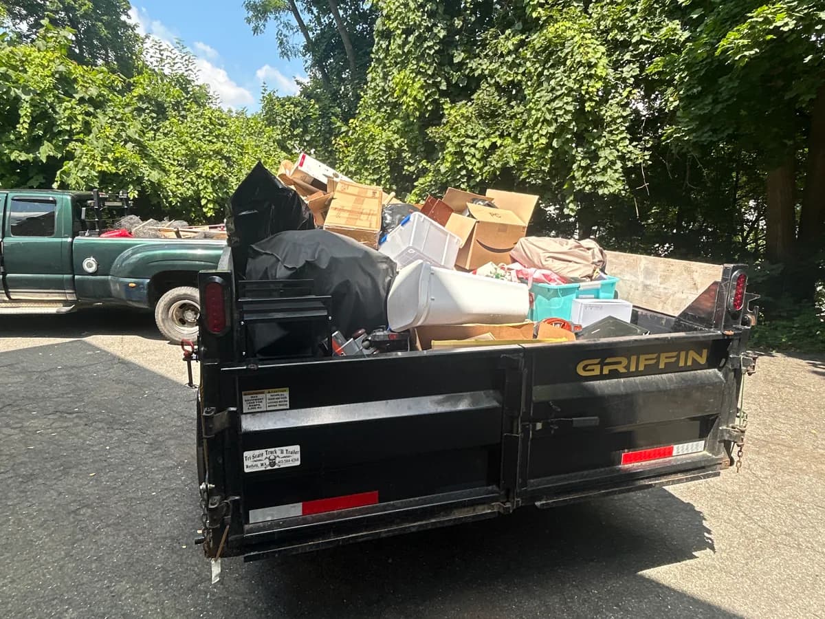 Junk Joy dump trailer loaded after a Manchester garage cleanout